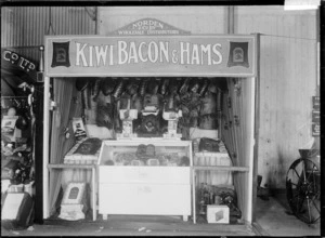 Stall at a trade fair advertising and displaying the produce of Kiwi Bacon & Hams