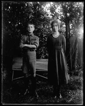 Boy and young woman in garden