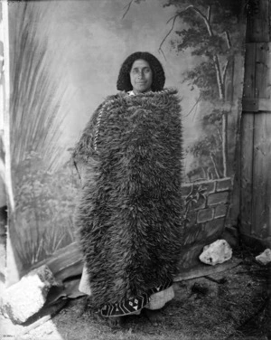 Studio portrait of an unidentified Maori woman wearing a kahu huruhuru (feather cloak) - Photograph taken by William Henry Thomas Partington