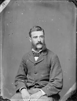 Unidentified man with a beard in the style known as 'friendly mutton chops'