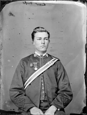 Lieutenant Slight, seated and wearing a medal