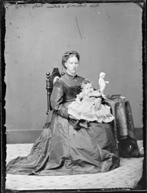 Miss Ashworth, seated and holding the Aikens baby - Photograph taken by Thompson & Daley of Whanganui