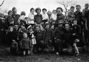 Soldiers and children at a children's party organised by of 21 Battalion, in Muccia, Italy, during World War II