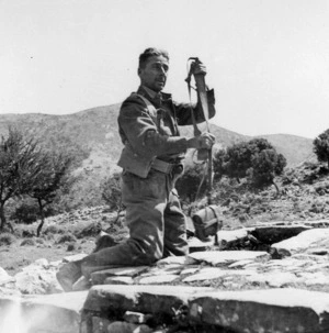 Robert Hassall England filling his water bottle from an old well during the withdrawal in Crete