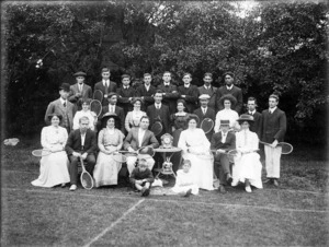 Group, some holding tennis rackets