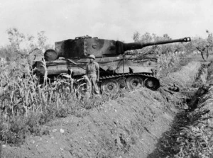 Member of the New Zealand 18th Battalion with a captured Tiger tank in Italy