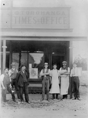 J H Claridge, and others, standing in front of the Otorohanga Times office