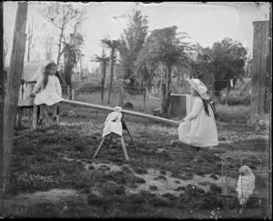 Two young girls on a see-saw