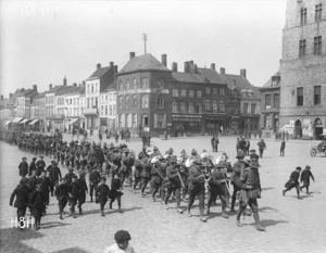 New Zealand troops marching through Bailleul, France
