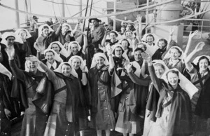 Nurses, waving farewell from a deck of a troopship during World War II