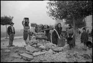 Women collecting water in the war damaged village of Gessopalena, Italy