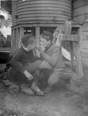 Two boys smoking cigarettes