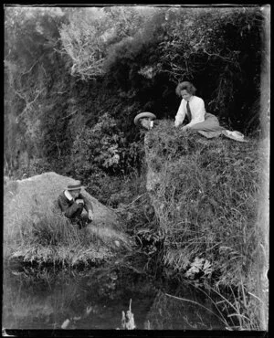Woman and two boys on riverbank