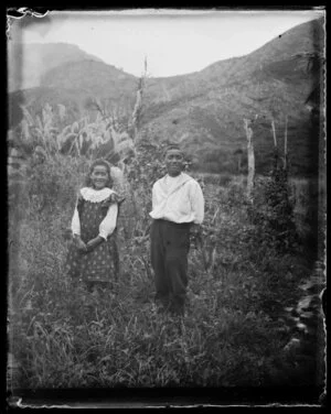 Two Māori children in a paddock