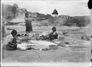Women washing clothes in a hot pool at Whakarewarewa