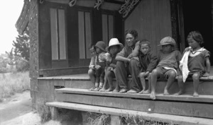 Group of Maori children on the steps of an unidentified meeting house