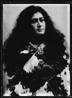 Copy photograph of Annie Chadwick wearing a kahu huruhuru cloak and a hei tiki