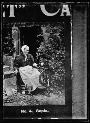 Copy photograph of a woman spinning wool