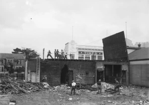 Demolition site in Pamerston North showing men pulling down a wall