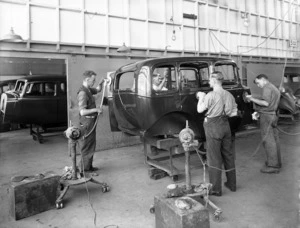 Men at General Motors buffing the body of a Vauxhall car