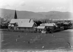 Cricket game being played in front of St Mark's Anglican Church, Wellington