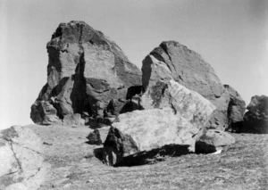 Rock called "Old Woman on Leaning Rock" (left) and smaller rocks surrounding it, on the summit of the Dunstan Range, Central Otago District