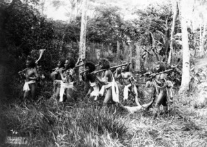 Fijian men posed with captured prisoner. "Vanquished"