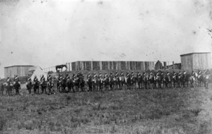 Mounted troops alongside the stockade at Ruataniwha, during the New Zealand Wars