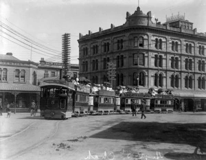 Four double decker trams pulled by "Puffing Billy", High Street, Christchurch