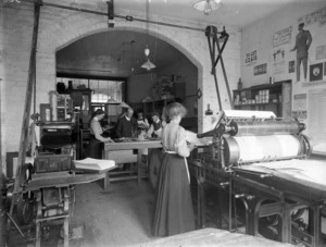 Men and women working inside the printing business of George Davis, Christchurch