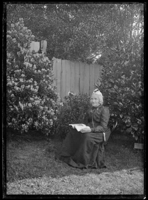 Sarah Jane Kirk seated in the garden
