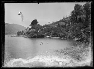 Small boats moored below on a bushy hillside