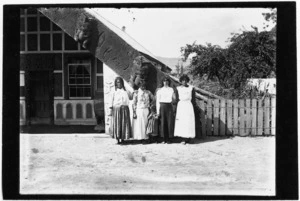 Women outside meeting house, Koriniti