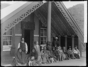 Group outside the Huriwhenua meeting house at Ranana - Photograph taken by William Henry Thomas Partington