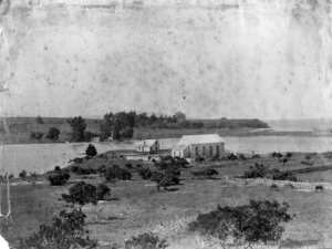 Martin, Josiah, 1843-1916 : Photograph of Waitangi marae at Te Tii, on the banks of the Waitangi River, showing the hall Te Tiriti o Waitangi and the Waitangi Treaty Memorial