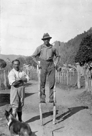 Unidentified man on stilts near the Wanganui River