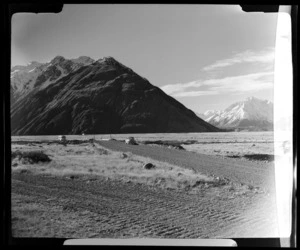 Mount Cook and Southern Lakes Tourist Co Ltd bus on the road to the Hermitage, Mackenzie District, Canterbury Region