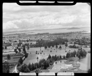 Arikikapapa Reserve with thermal lakes and Rotorua Golf Club Course in foreground, looking to Rotorua Central Business District and Lake beyond, Bay of Plenty Region