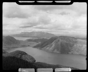 Lake Rotokakahi (Green Lake) surrounded by forest, looking toward Tarawera, Rotorua District, Bay of Plenty Region