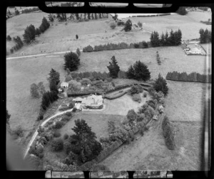 View of Glenholme homestead, surrounded by garden and fields, Rotorua region