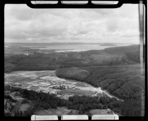 Waipa State Forest Sawmill surrounded by pine forest with Lake Rotorua and City beyond, Bay of Plenty Region