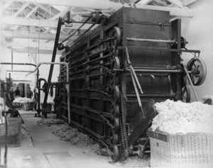 Men operating a wool dryer