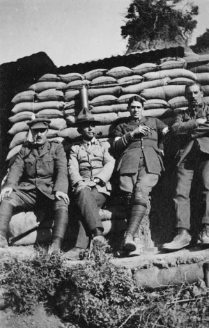 Four soldiers photographed against a wall of sandbags, Gallipoli, Turkey