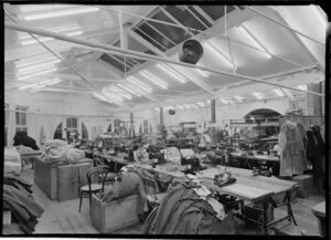 Factory with sewing machines & piles of fabric