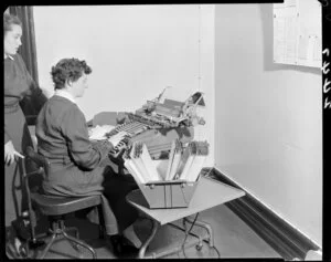 Woman typing at desk