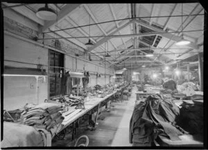 Factory with sewing machines & piles of fabric
