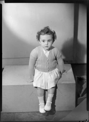 Young girl modelling knitted cardigan