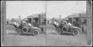 Schaef, Arthur W (Wellington), fl 1890 :A group of people sitting in an open car, parked at Parihaka