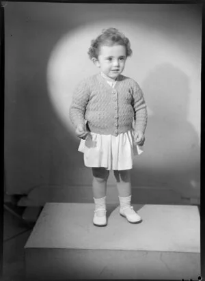 Young girl modelling knitted cardigan