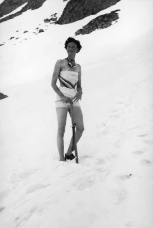 Photograph of a woman standing in the snow